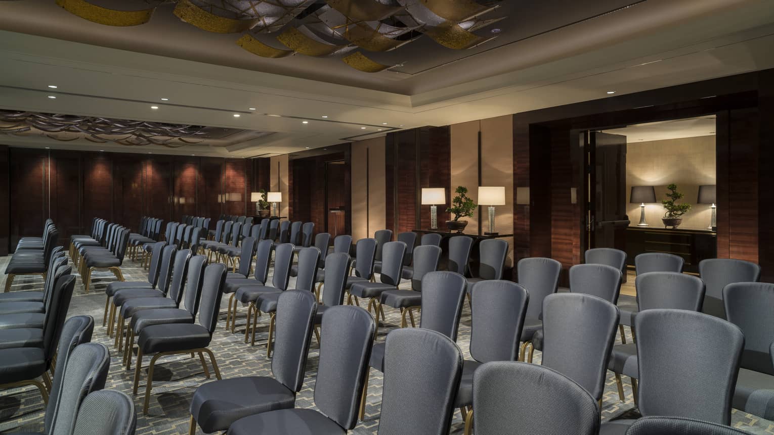 Rows of meeting chairs in ballroom conference and event space 
